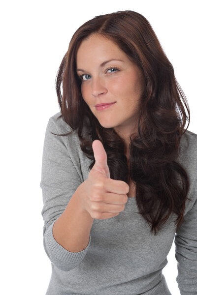 Happy young woman showing thumbs-up on white background