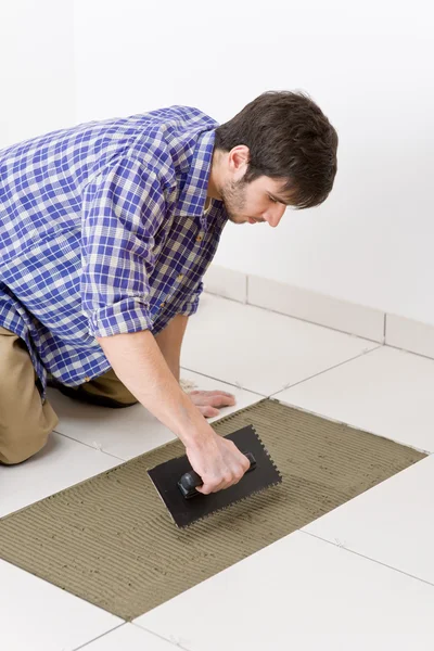 Home improvement - handyman laying tile — Stock Photo, Image