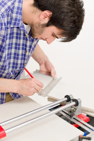 Home improvement - handyman cut tile — Stock Photo, Image