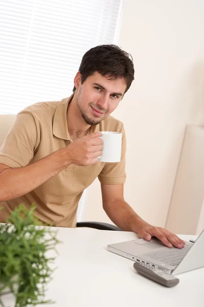 Successful modern businessman with cup of coffee — Stock Photo, Image