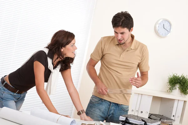 Young man and woman working at architect office — Stock Photo, Image