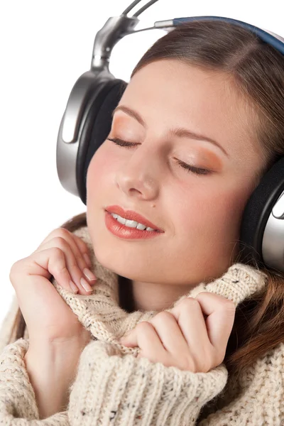 Portrait of happy woman enjoying music with headphones — Stock Photo, Image