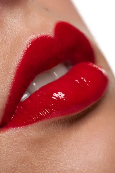 Close-up of gloosy red woman lips — Stock Photo, Image