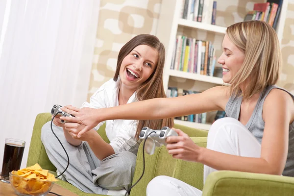 Students - Two happy female teenager playing TV game — Stock Photo, Image