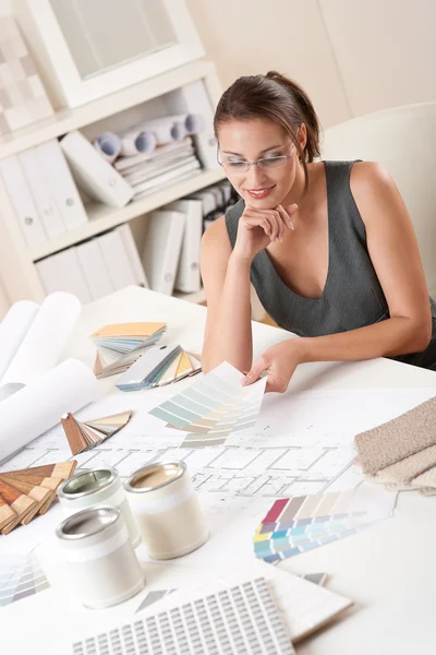 Female interior designer working with color swatch — Stock Photo, Image