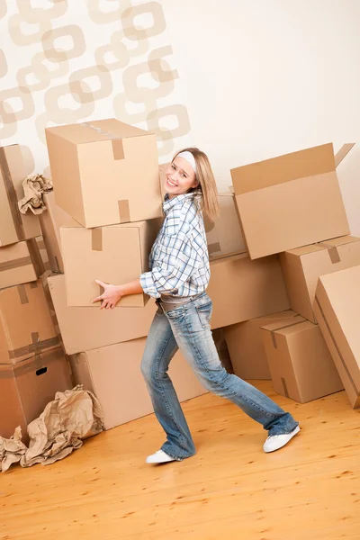 Moving house: Woman holding big carton box — Stock Photo, Image