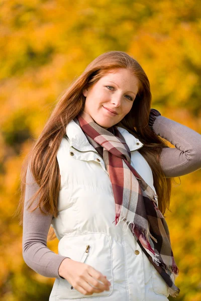 Autumn park - long red hair woman fashion Royalty Free Stock Photos