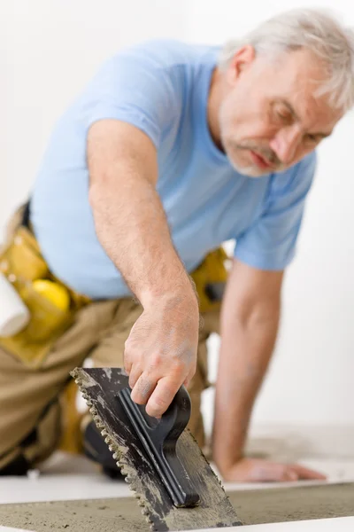 Home Improvement Renovation Handyman Laying Tile Trowel Mortar Royalty Free Stock Images
