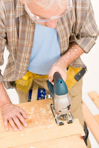 Home improvement - handyman cut wood with jigsaw Stock Picture