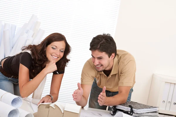 Man and woman at architect office working Stock Image