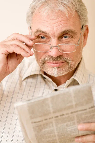 Senior mature man with glasses and newspaper — Stock Photo, Image