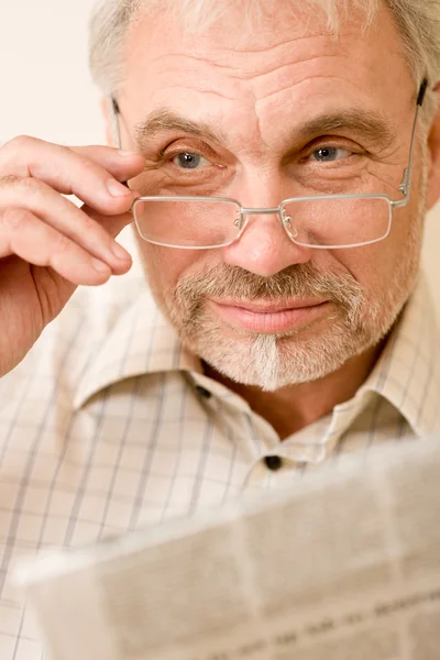 Senior mature man with glasses and newspaper — Stock Photo, Image
