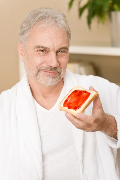 Senior mature man - breakfast at home — Stock Photo, Image