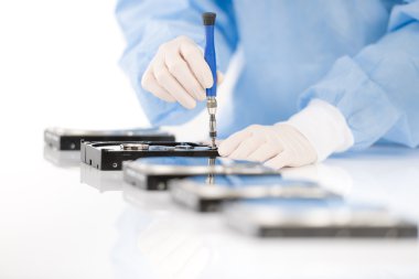 Computer engineer repair hard disc defect, sterile clipart