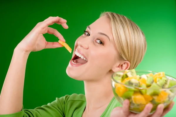 Healthy lifestyle - woman eat fruit salad — Stock Photo, Image