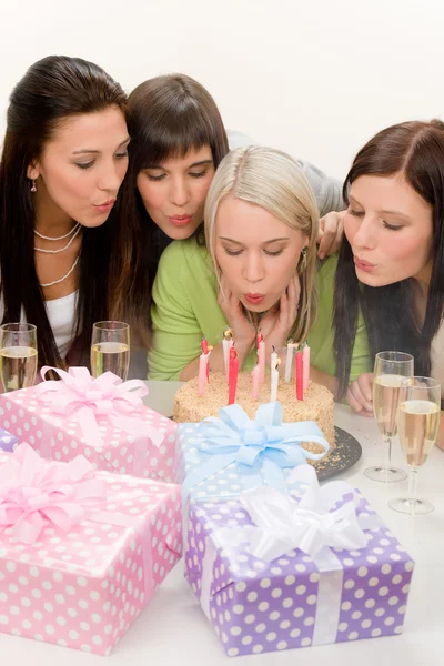 Birthday party - woman blowing candle on cake — Stock Photo, Image