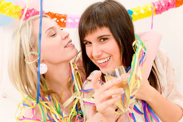 Birthday party celebration - two woman with confetti have fun — Stock Photo, Image
