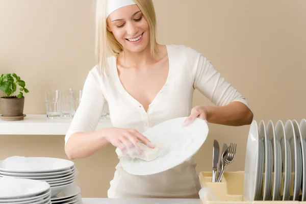 Modern kitchen - happy woman washing dishes — Stock Photo, Image