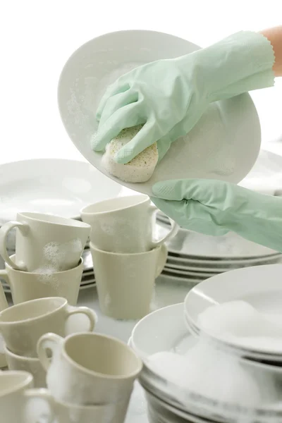 洗盘子-戴着手套在厨房里的手 — 图库照片