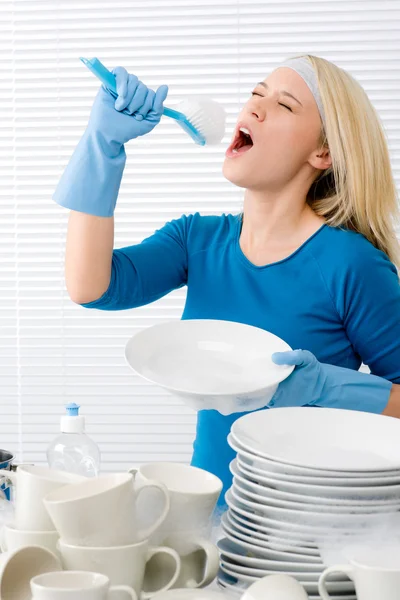 Modern kitchen - woman pretend to sing song — Stock Photo, Image