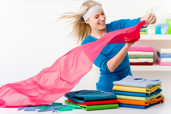 Laundry - woman folding clothes — Stock Photo, Image