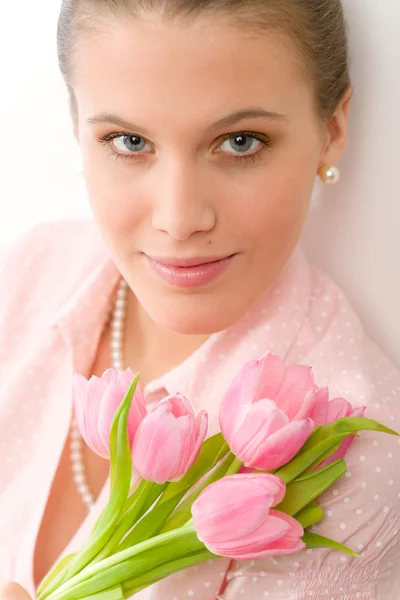 Fashion - young romantic woman with spring tulips — Stock Photo, Image