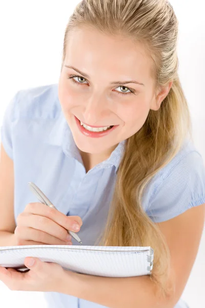 Šťastný student žena psát poznámky na bílém pozadí — Stock fotografie
