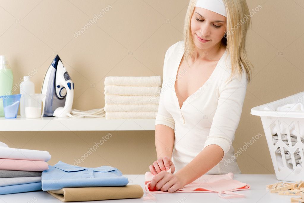 Laundry ironing - woman folding clothes
