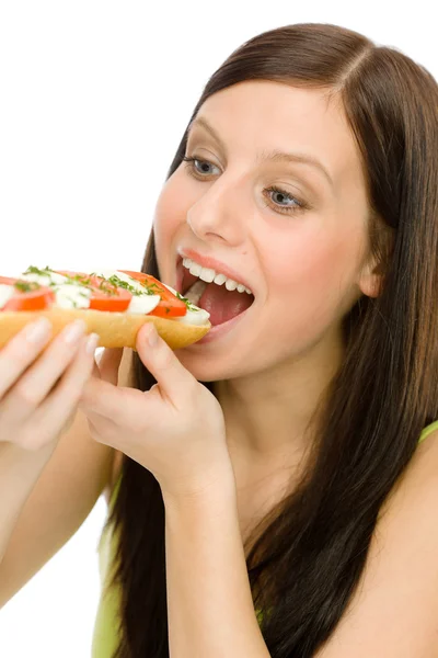 Healthy lifestyle - woman eat caprese sandwich — Stock Photo, Image