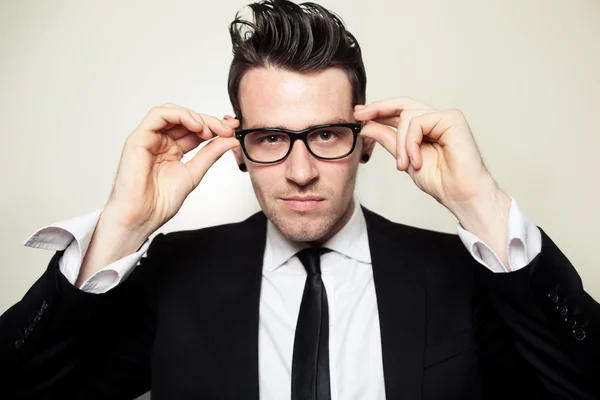 Confident Young Man Holding Black Glasses — Stock Photo, Image
