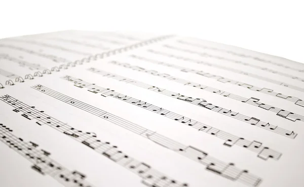 Hoja de notas musicales aislada en blanco — Foto de Stock