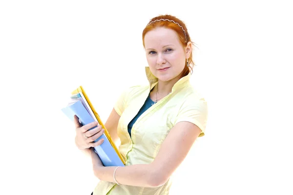 Redhead young woman student holding a notebooks Stock Photo