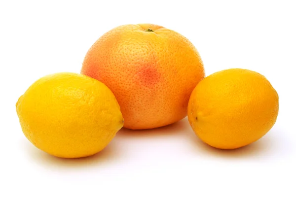 Two lemons and grapefruit — Stock Photo, Image