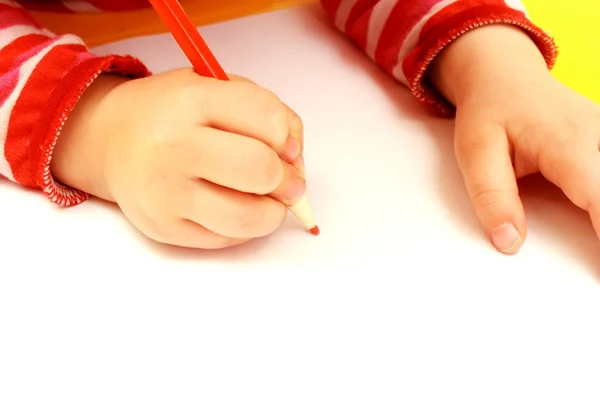 Stock image Hand of child drawing on a paper