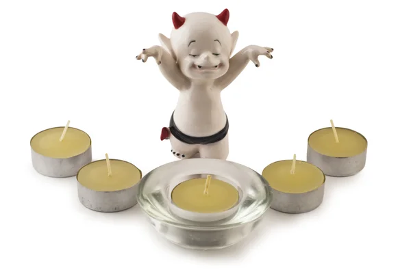 Devil with Christmas candles — Stock Photo, Image