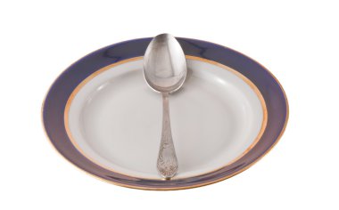 Fork And Spoon Crossed On Plate clipart