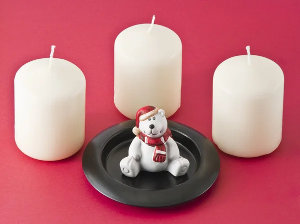 Svíčky a figurka medvídka — Stock fotografie