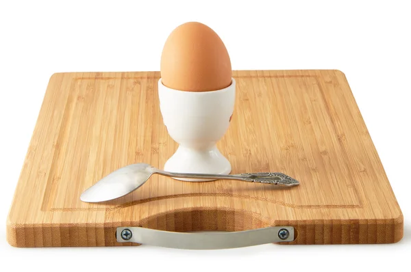 Egg on a stand with a spoon — Stock Photo, Image
