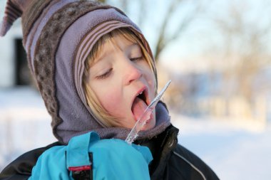 Child icicle winter licking clipart