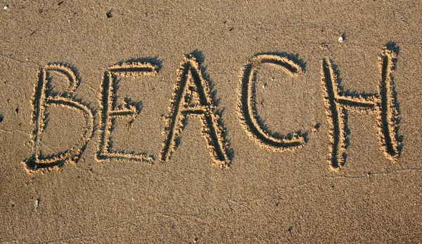 Beach writting in sand — Stock Photo, Image