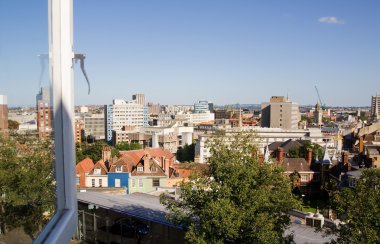 Cityscape seen through window. Bristol city major english town ariel view over rooftops