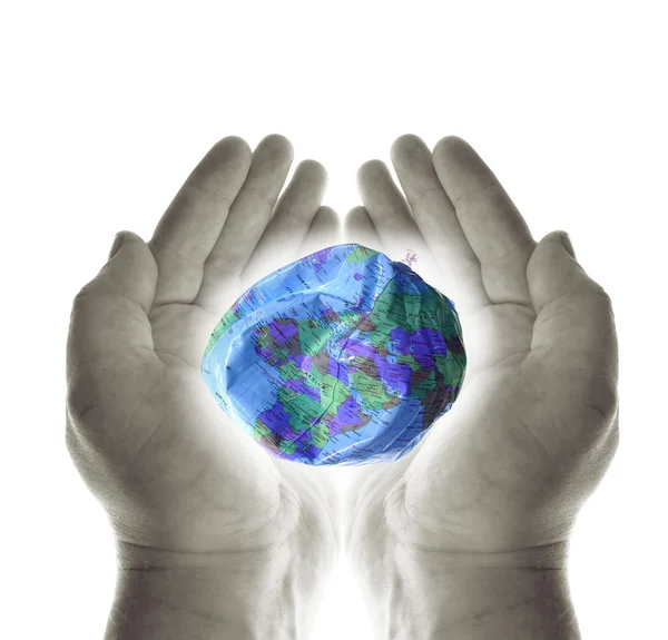 stock image Heal the planet. hands holding a deflated earth protecting the environment