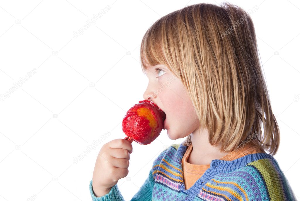 Toffee apple child eating sweets — Stock Photo © tlorna 4574471