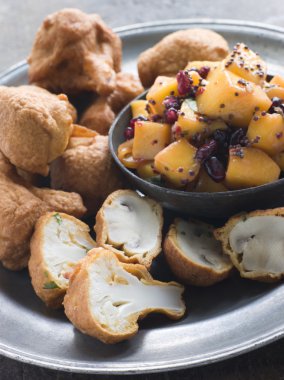 Dish of Pakoras- Mushroom and Cauliflower with Mango Mustard and Pomegranate Salad clipart