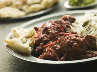 Pewter Plate With Meat Phall Fragrant Basmati and Naan and side dishes clipart