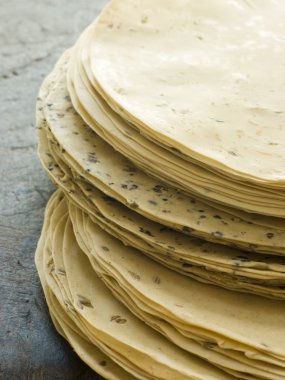 Stack of uncooked Papadoms clipart