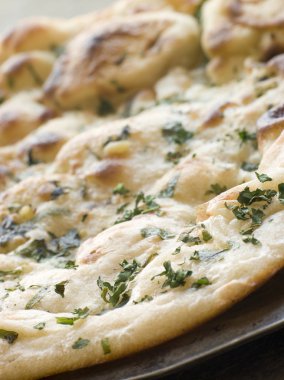 Plate of Garlic and Coriander Naan Bread clipart