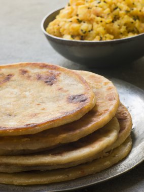 Plate of Aloo stuffed Parathas clipart