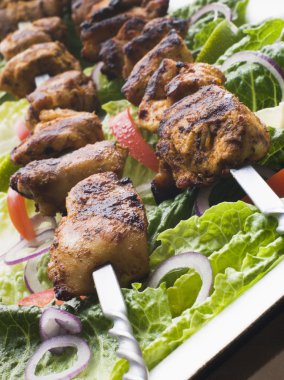 Plate of Chicken Tikka Marinated Shashlik Kebabs clipart