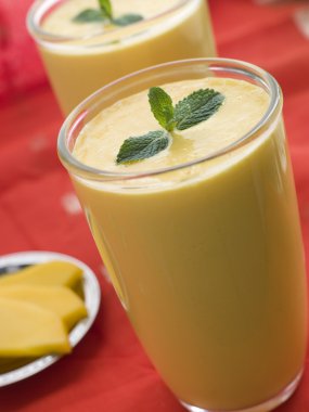 Glasses of Mango Lassi with Mango Side clipart